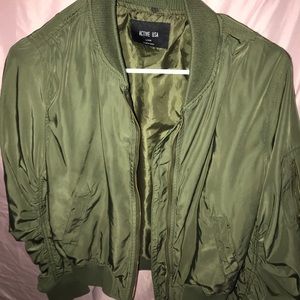 Green zip up sweater . Has pockets on sides and zip up sweaters. Size L fits M